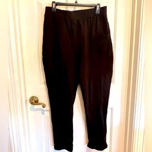 CAbi high rise black pants. Asymmetrical pockets in the front.